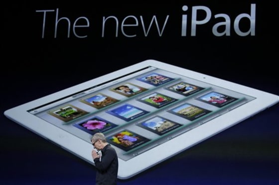 Apple CEO Tim Cook clasp his hands during an new iPad announcement during an Apple event in San Francisco, Wednesday, March 7, 2012. The new iPad features a sharper screen and a faster processor. Apple says the new display will be even sharper than the high-definition television set in the living room. (AP Photo/Paul Sakuma)